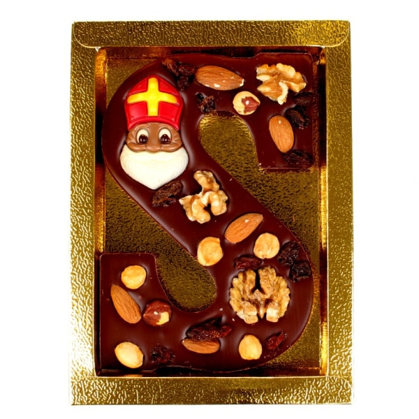 Pure letter met noten in gouden doos